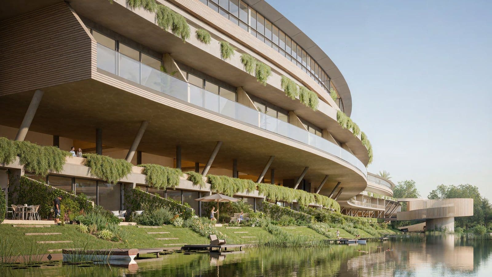 The planted north facade of Médano rising above the lagoon